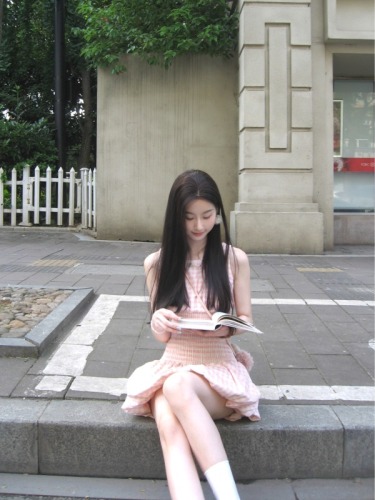 Real shot of a short dress with a sweet design and a waist-cinching plaid skirt.