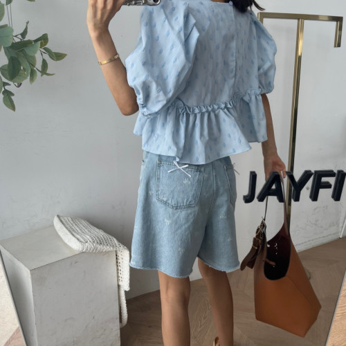 Raw edge quarter denim shorts with tiny bows on the back pockets