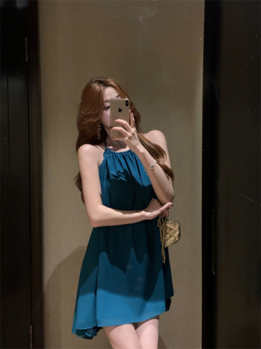 Actual shot of pure lusty style blue backless halterneck dress for women with stunning design and sexy resort style skirt