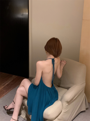 Actual shot of pure lusty style blue backless halterneck dress for women with stunning design and sexy resort style skirt