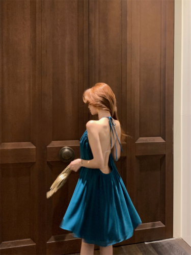 Actual shot of pure lusty style blue backless halterneck dress for women with stunning design and sexy resort style skirt