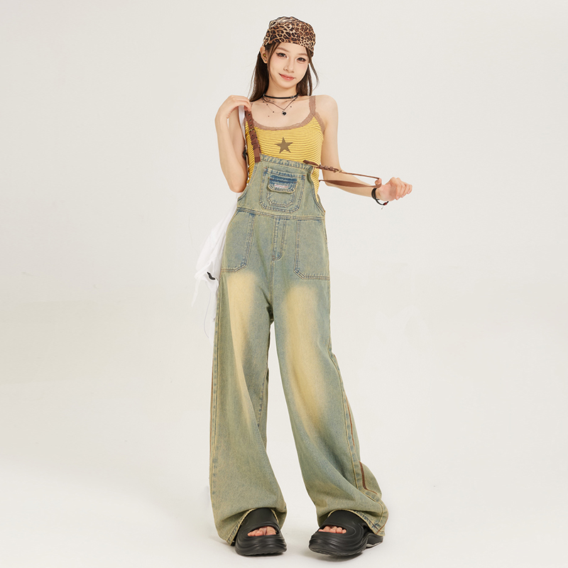 Photographed denim overalls with a fall American casual style 2024 girl's loose earthy yellow wide-leg jeans