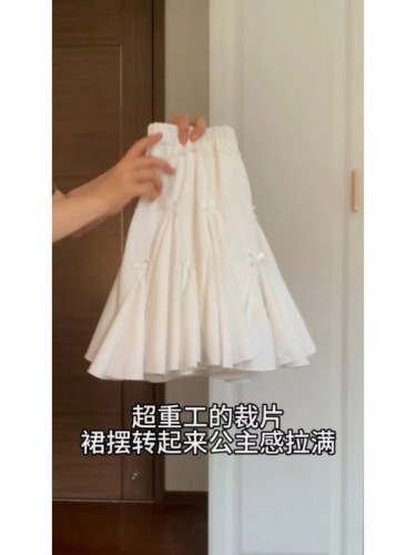 A little white dress that feels like first love!  Pure lust style small bow skirt women's summer slim elastic waist A-line skirt