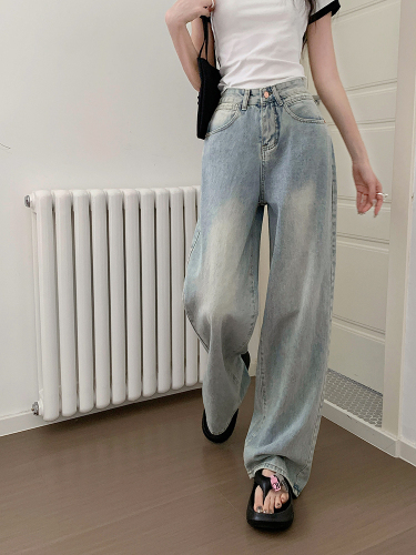 Actual shot of retro light-colored wide-leg denim floor-length trousers