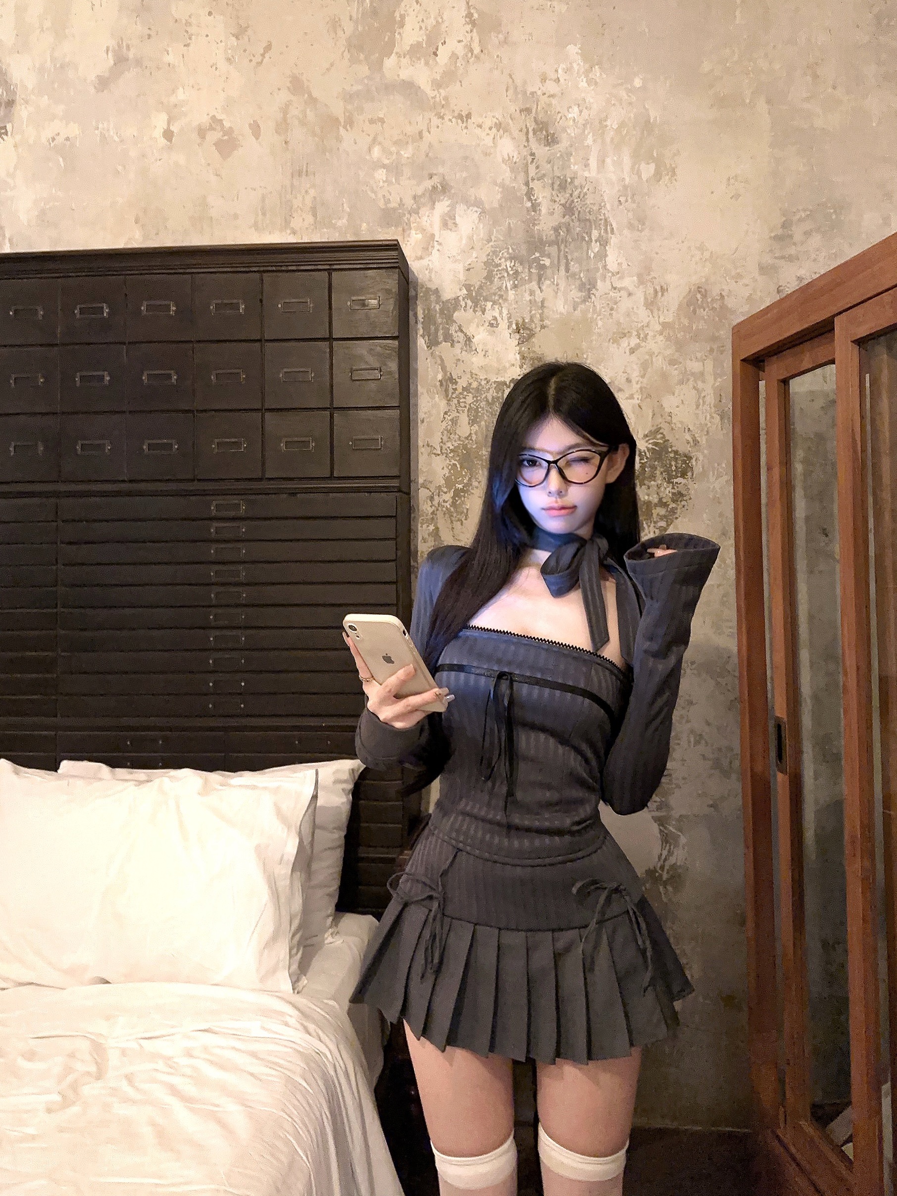 Actual shot of a pure lust hottie wearing a slim-fitting tube top + short cardigan + bow high-waisted pleated skirt suit