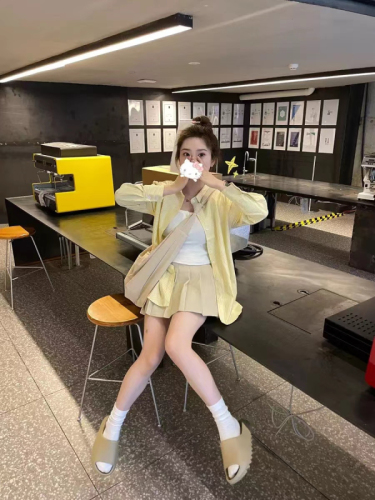 2024 New Creamy Yellow Striped Shirt Women's Loose Versatile Niche Shirt Design High-End Spring and Summer Sun Protection Clothing