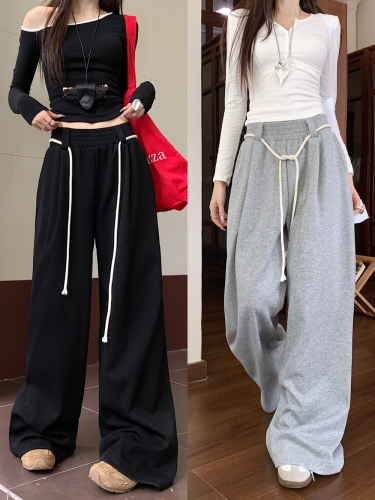 Actual shot of lazy style casual high-waisted straight wide-leg trousers with drapey floor-length trousers for women