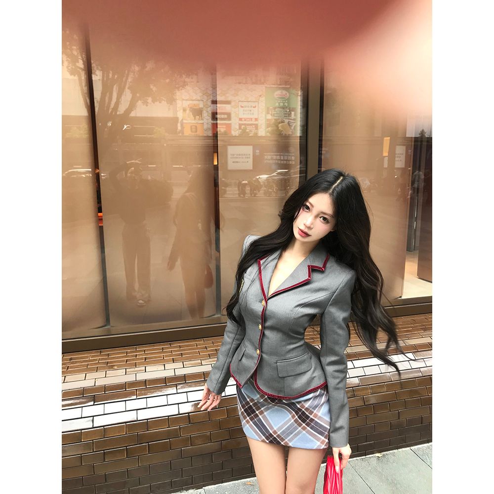 Actual shot of a British high school girl's college style suit, slim blazer, plaid skirt, two-piece set