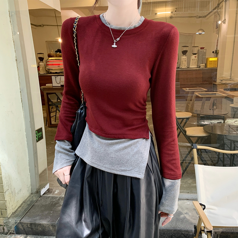 Fake two-piece spliced ​​round neck long-sleeved T-shirt for women 2024 autumn waist-cinching temperament design irregular top bottoming shirt