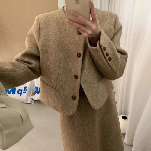 Woollen tweed featherdown suit with a sophisticated, slimming and chic designer vibe, tailored for a discerning, fashion-forward crowd.