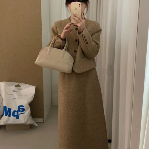 Woollen tweed featherdown suit with a sophisticated, slimming and chic designer vibe, tailored for a discerning, fashion-forward crowd.