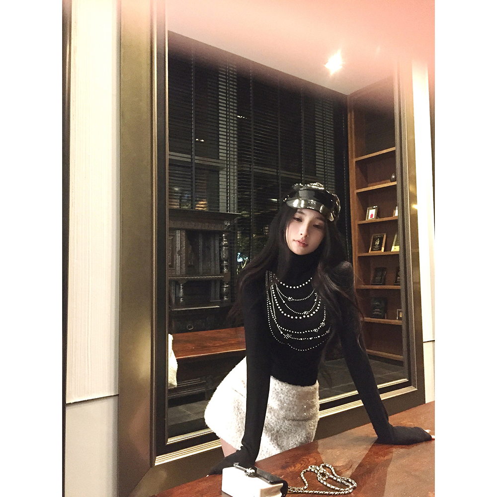 Actual shot of pearl chain merino tencel wool turtleneck sweater + white sequin hoop skirt