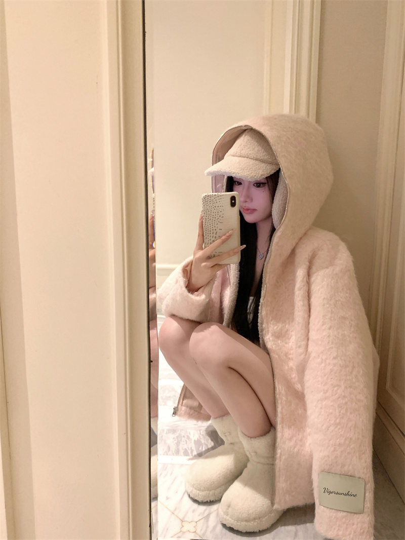 Actual shot of a soft pink hooded fur coat for a small person, a sweet and age-reducing cardigan top