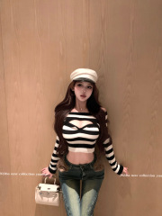 Actual shot of a sexy hot girl wearing a striped one-shoulder hollow soft and waxy knitted slim long-sleeved top