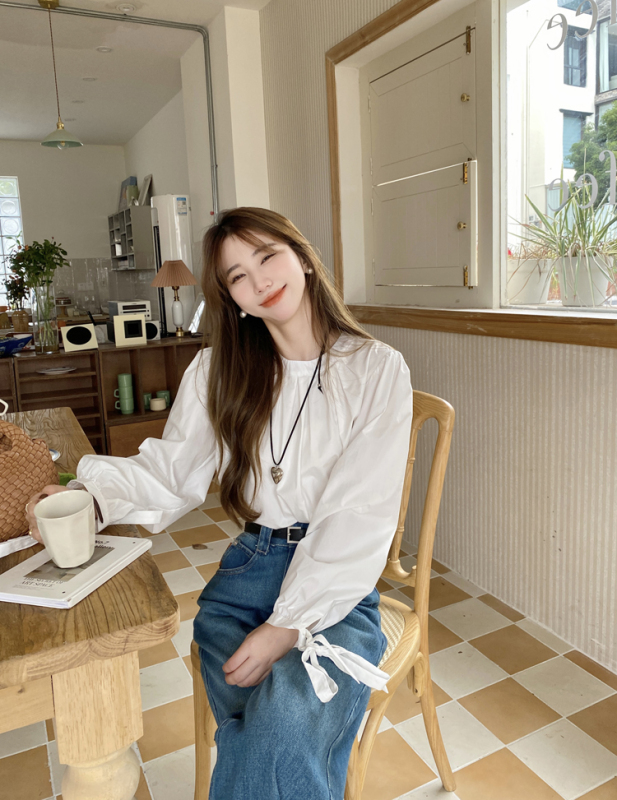 White lantern sleeve lace-up shirt with versatile design and round neck top