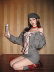 Real shot of pictorial girl splicing fake two-piece lace-up hot girl autumn and winter knitted sweater dress