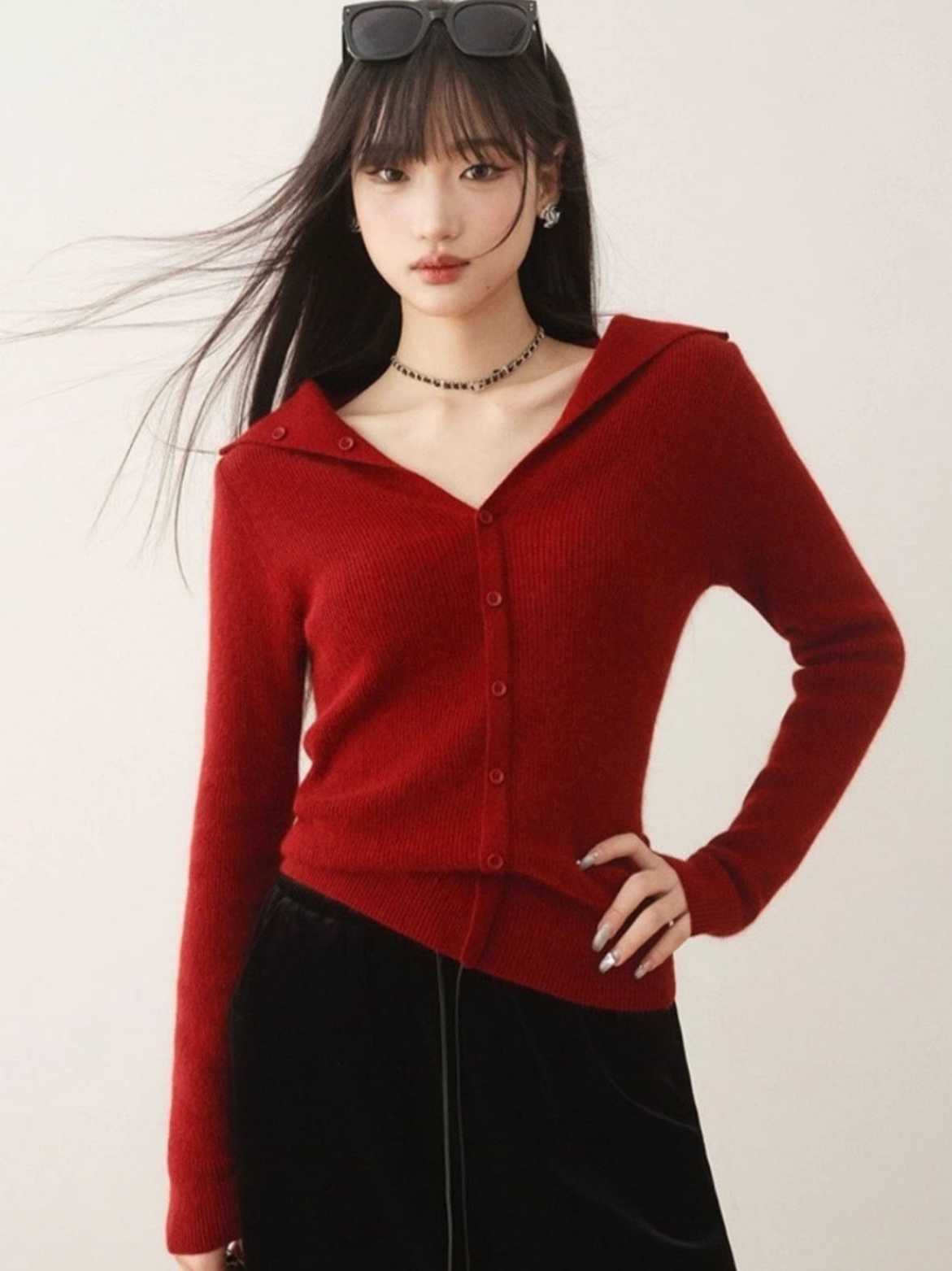 A stylish, single-breasted, knitted cardigan sweater with a design twist, perfect for casual wear, versatile, soft, comfortable, and flattering for a slim silhouette.