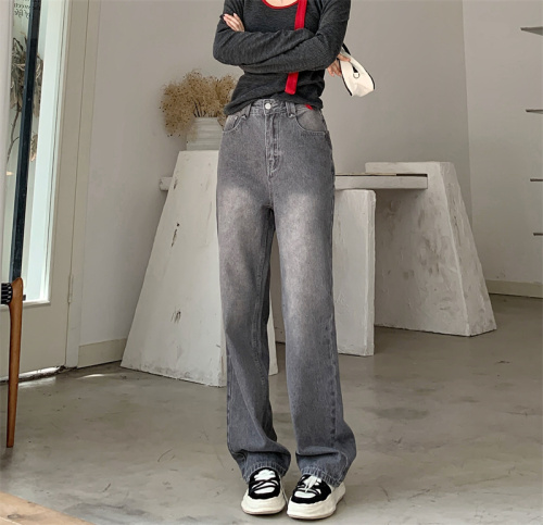 Real shot of high-waisted loose gray straight-leg jeans, trousers and floor-length pants for women