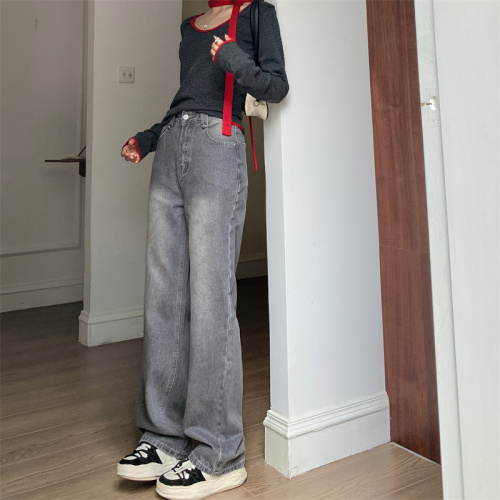 Real shot of high-waisted loose gray straight-leg jeans, trousers and floor-length pants for women