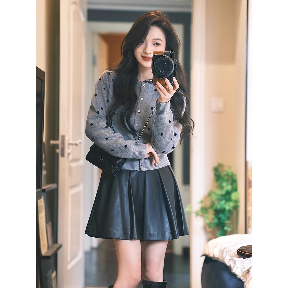 Pair of large size plus-size polka dot knit tops and PU leather short skirts in a Korean style, high-end set for women