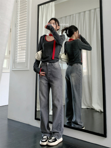 Real shot of high-waisted loose gray straight-leg jeans, trousers and floor-length pants for women