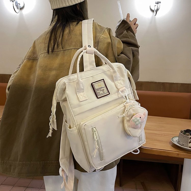 Japanese ins style schoolbag female junior high school student high-looking girl backpack simple travel Korean version portable shoulder bag