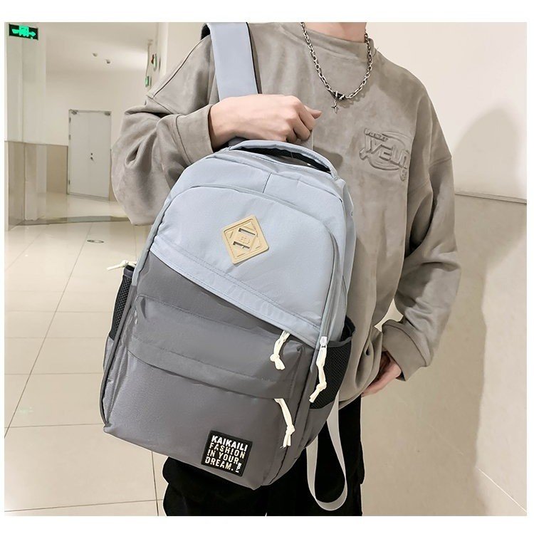 Large-capacity color-blocked backpack 2024 new college student high school student computer backpack Korean version fashion couple school bag