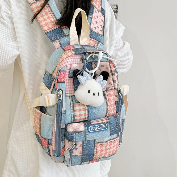 Schoolbag female high-looking niche primary school student plaid stitching backpack Korean version ins junior high school student backpack