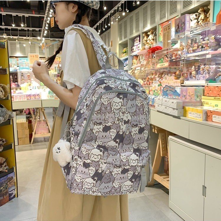 Junior high school student schoolbag female high-looking fashionable casual graffiti backpack small fresh and cute printed ladies backpack