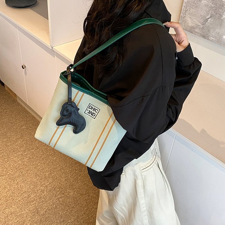 Cloth bag women's 2024 new summer niche design shoulder bag Korean canvas hand bucket bag armpit bag