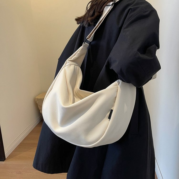 Large capacity commuter niche design casual simple versatile new textured canvas one-shoulder cross-body dumpling bag wholesale