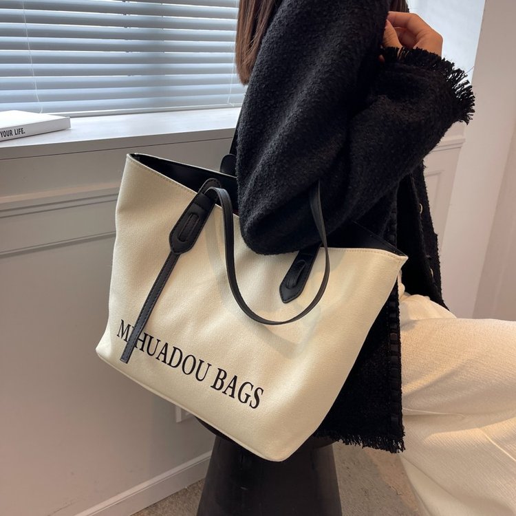 Tote bag, versatile new canvas women's bag, autumn and winter large capacity, high-end shoulder bag, large commuter bag