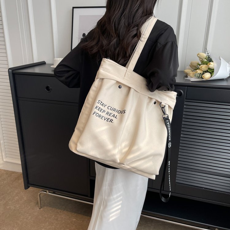 One-shoulder canvas bag for women, new style, high-end, large-capacity student tutoring bag, fashionable and versatile, niche women's tote bag