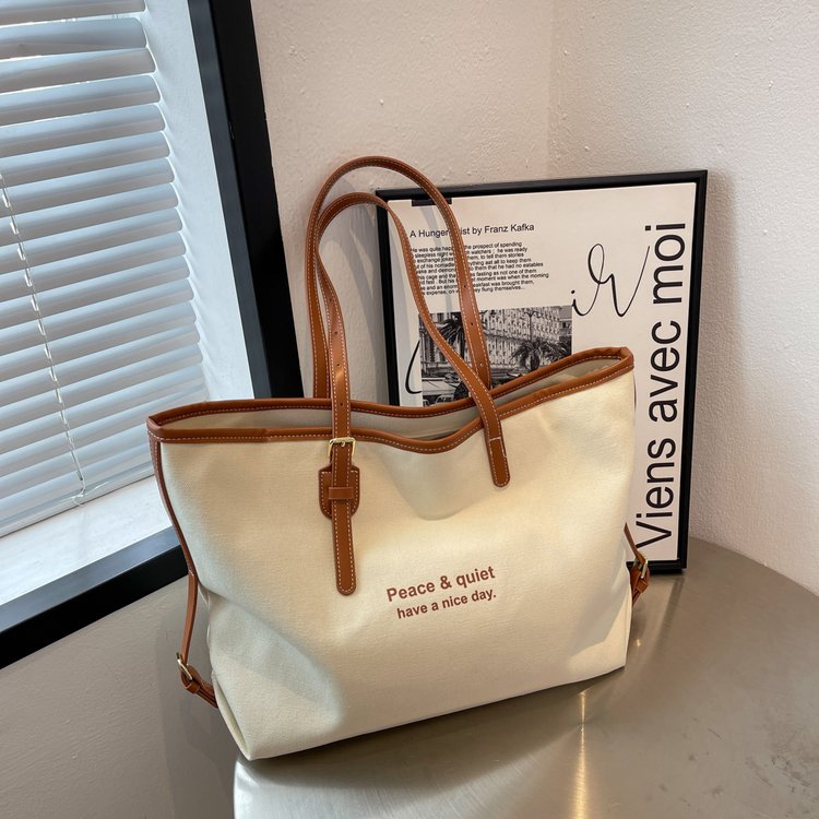 Large capacity canvas bag women's new trendy fashion niche shoulder bag versatile college student class commuting bag