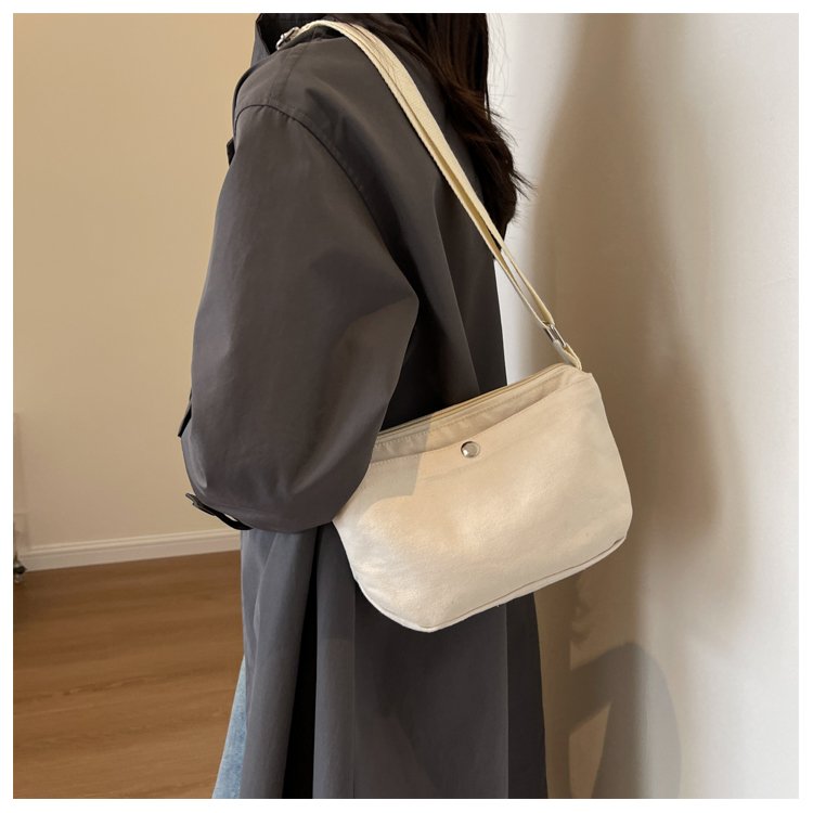 Manufacturer customized canvas small bag, commuter mobile phone small square bag, shrink rope handle, casual and versatile crossbody bag, snap button outer pocket