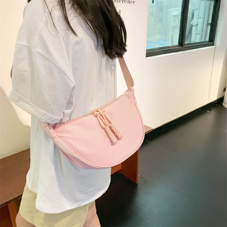 Simple, lightweight and compact canvas bag, women's casual saddle bag, commuting armpit shoulder bag, sports dumpling bag, crossbody bag
