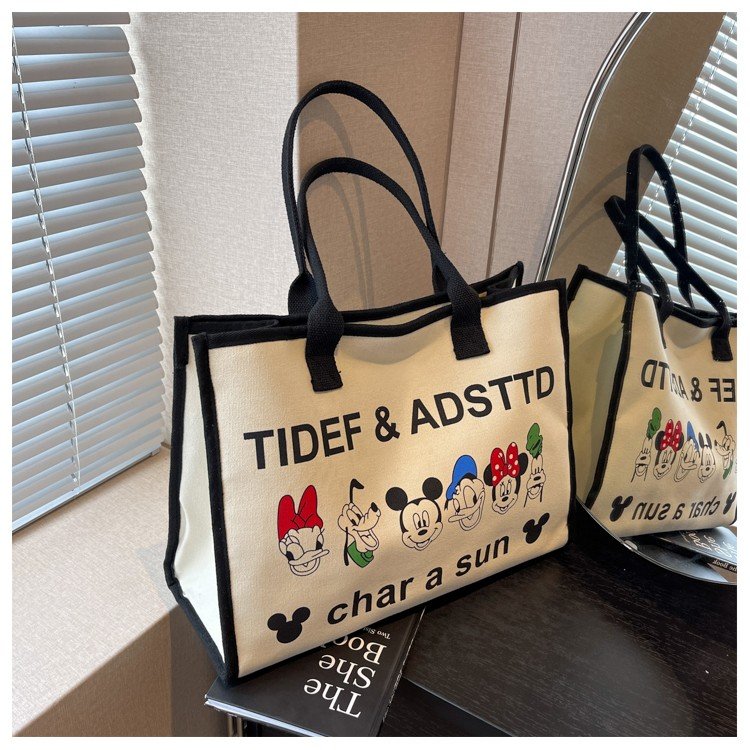Large-capacity canvas bag for women 2024 new Japanese cartoon shoulder bag casual and versatile commuter portable tote bag