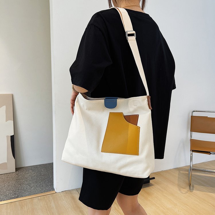 ins niche design spliced ​​canvas bag Korean style women's shoulder bag commuter tote bag versatile casual crossbody bag