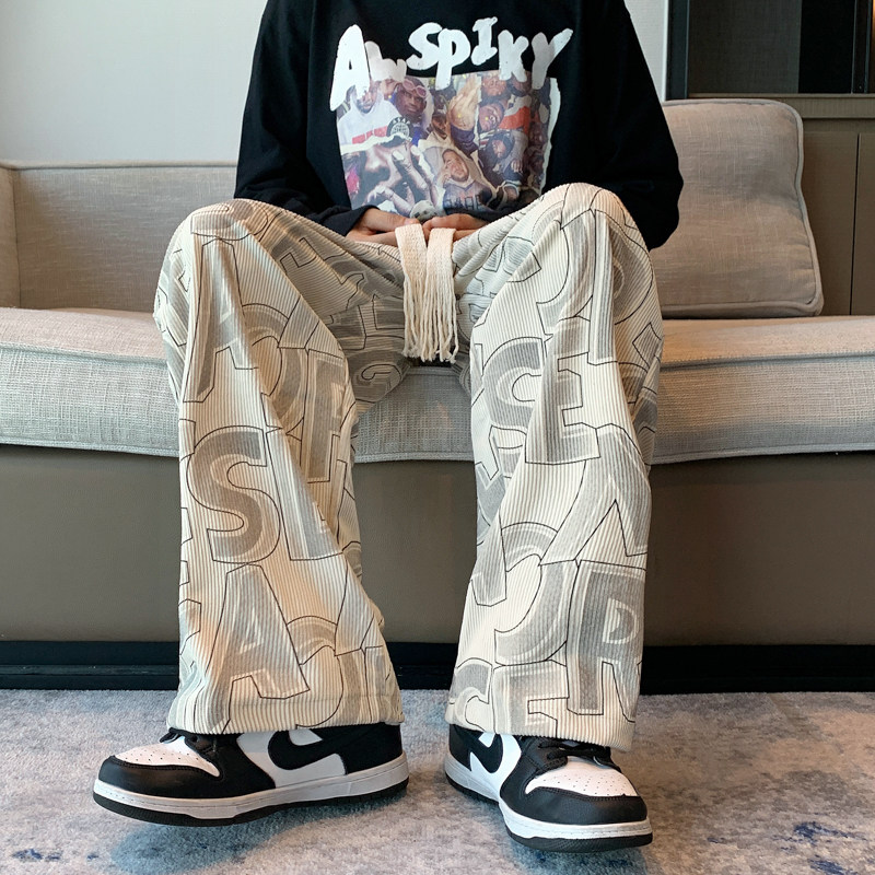 Loose type casual pants with Japanese letters printed all over for men, autumn trendy trousers