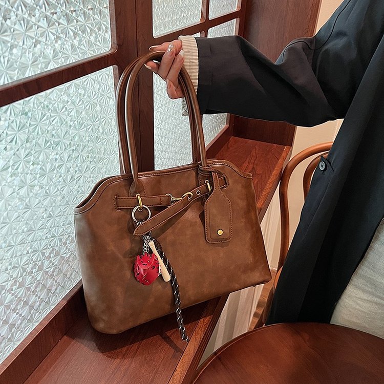 2024 new internet celebrity same style fashionable and versatile retro brown briefcase with concave shape design single shoulder handbag for women