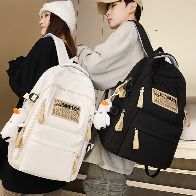 Spring and summer simple travel backpack computer backpack casual solid color label junior high school student large capacity school bag
