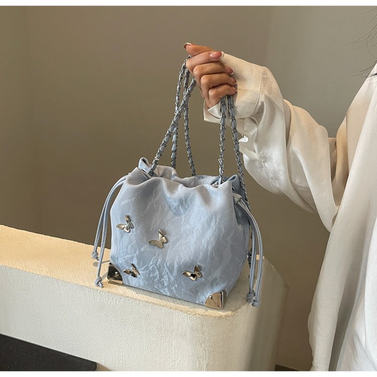 High-end metal bow bucket bag for women 2024 summer new style niche drawstring bag fashionable women's bag