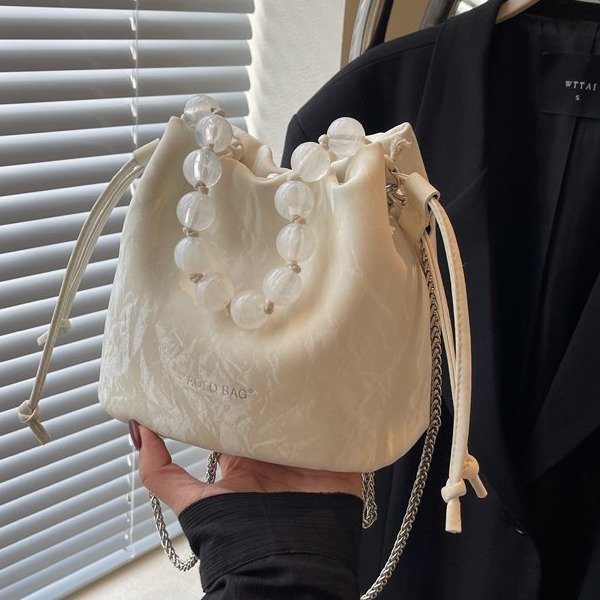Niche style pearl portable bucket bag for women 2024 new summer versatile chain shoulder crossbody bag small bag