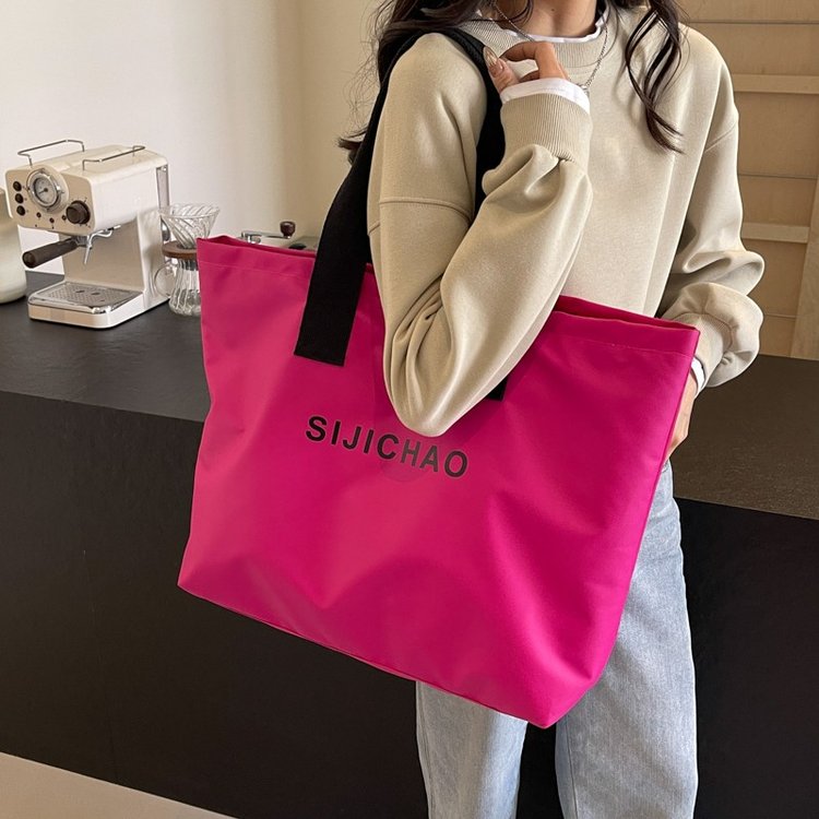 Foreign trade wholesale fashion nylon cloth tote bag large capacity casual shopping bag portable shoulder bag short distance luggage bag