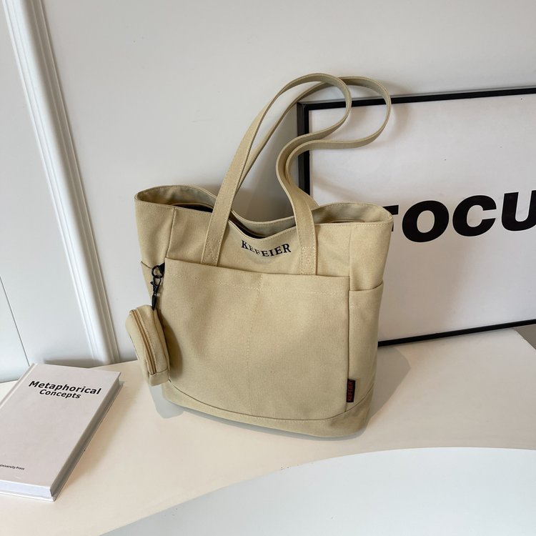 Large capacity women's canvas bag, personality, casual and versatile, women's shoulder bag, class commuting, niche design, women's tote bag