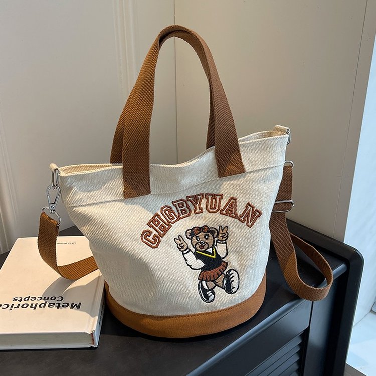 Japanese and Korean cross-border popular portable bucket bag women's new niche simple fashion canvas shoulder crossbody bag