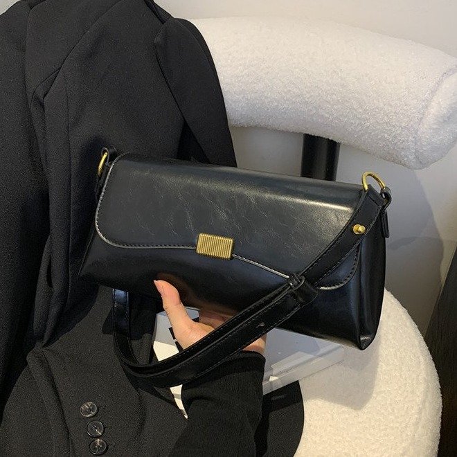 Niche design texture baguette underarm bag for women 2024 summer new style high-end black one-shoulder cross-body bag