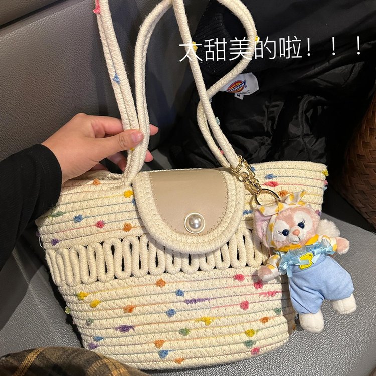 Pastoral style pearl button woven handbag ins new seaside vacation woven bag forest style one-shoulder vegetable basket bag