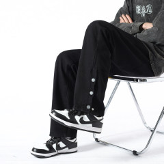 Spring fashionable trousers with button slit design and high street solid color denim