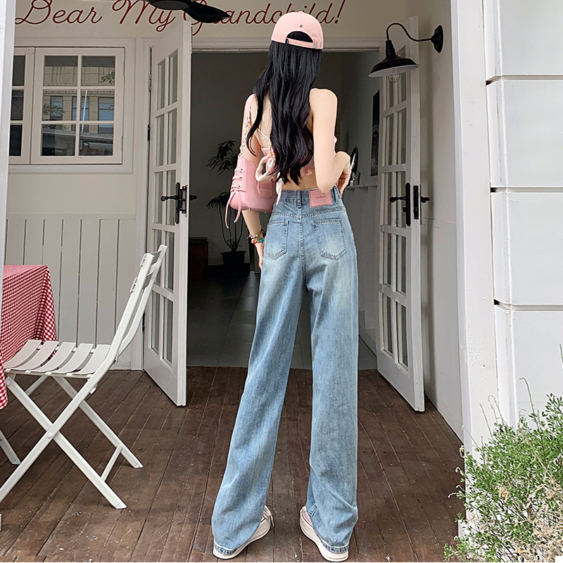 Actual shot of high-waisted wide-leg drapey floor-length trousers